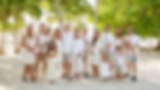 Lifestyle family beach photography session featuring an extended family portrait on the sand in Islamorada