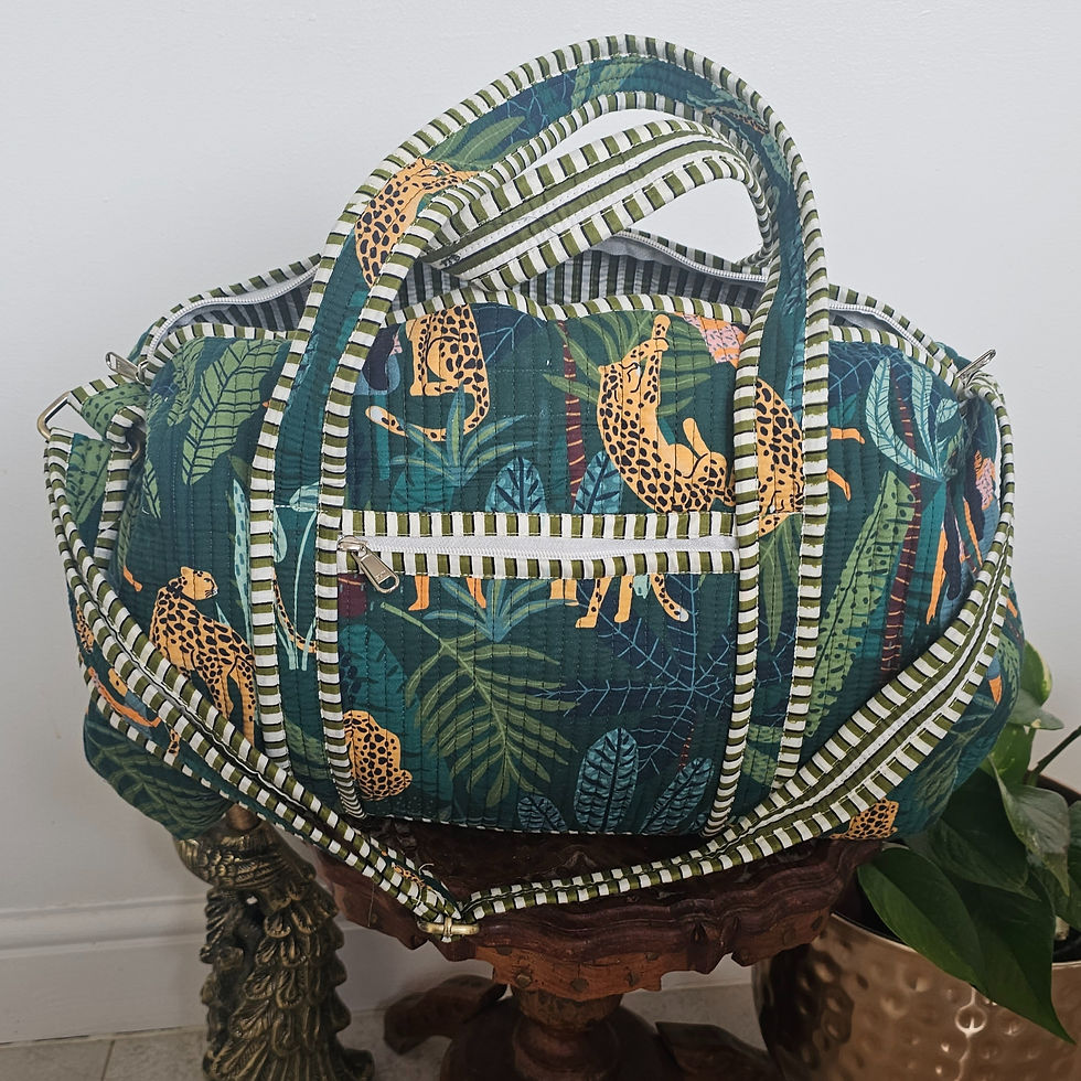 Jungle Safari travel collection featuring matching duffle bag and toiletry pouch set in dark tropical green leopard