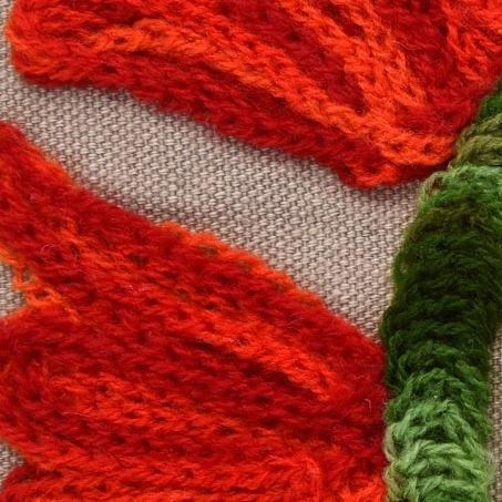 Thumbnail: Mira 16x16 vibrant red and yellow sunburst Suzani cushion cover by ZivaraJewels with multi-coloured pom-poms.