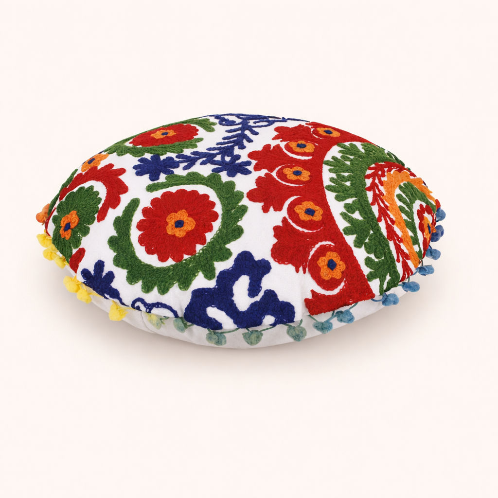 ndu 16 inch round Suzani cushion cover by ZivaraJewels with bold red and blue floral hand-embroidery.