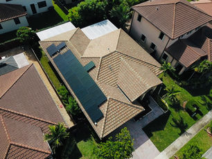 Professional solar panel installation on a tile roof in Miami featuring IronRidge racking and Enphase IQ8+ microinverters.