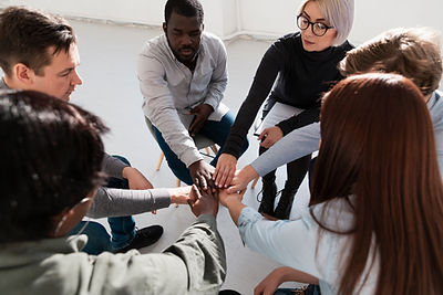 group-rehab-patients-putting-their-hands-together.jpg