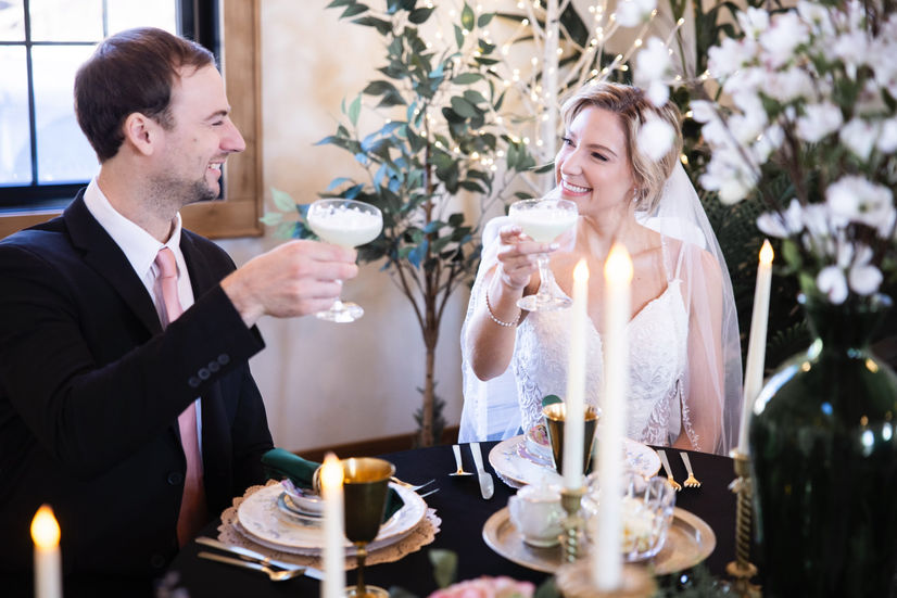 Wedding couple toast at reception in Merton event venue