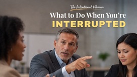 professional woman being interrupted in a meeting and responding with confidence and authority