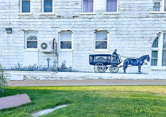 "Chapel Oaks Horse-Drawn Hearse" mural by local artists of Hiawatha, Kansas.
