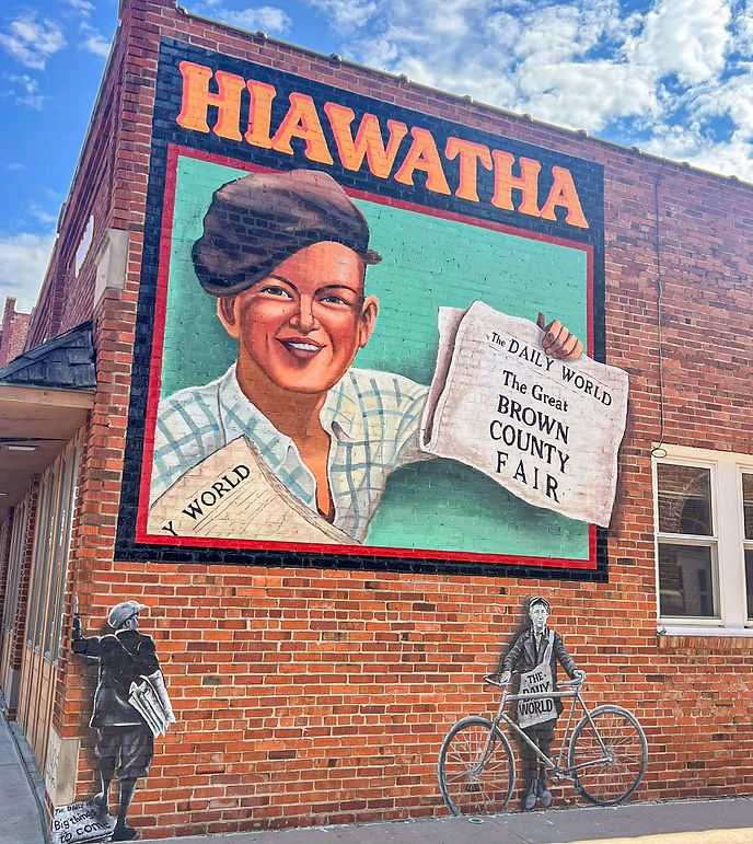 "Hiawatha Daily World Newspaper Boy" mural by local artist in Hiawatha, Kansas