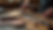 Close-up view of leather tools and materials on a wooden workbench