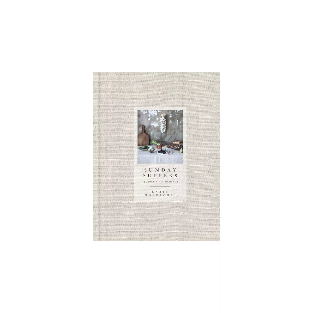 Sunday Suppers cook book with a beige linen cover