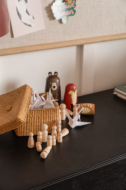 Toys on a black dresser in a kids bedroom designed by Miami Interior Designer The Habitat Collective