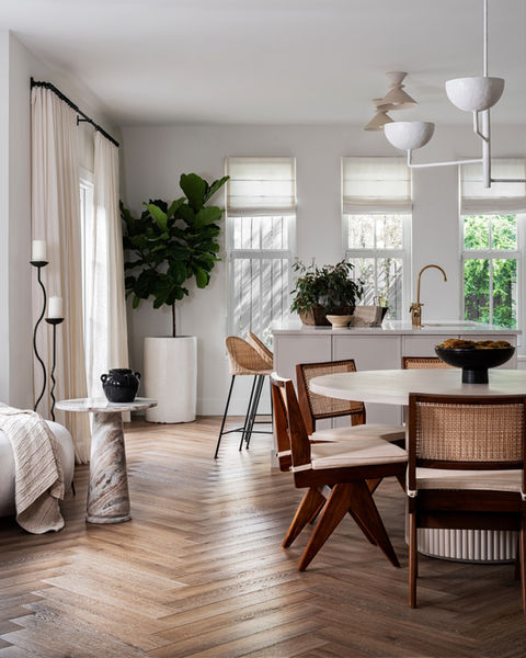 Warm modern kitchen, lounge and dining room by Miami Interior Designer The Habitat Collective.