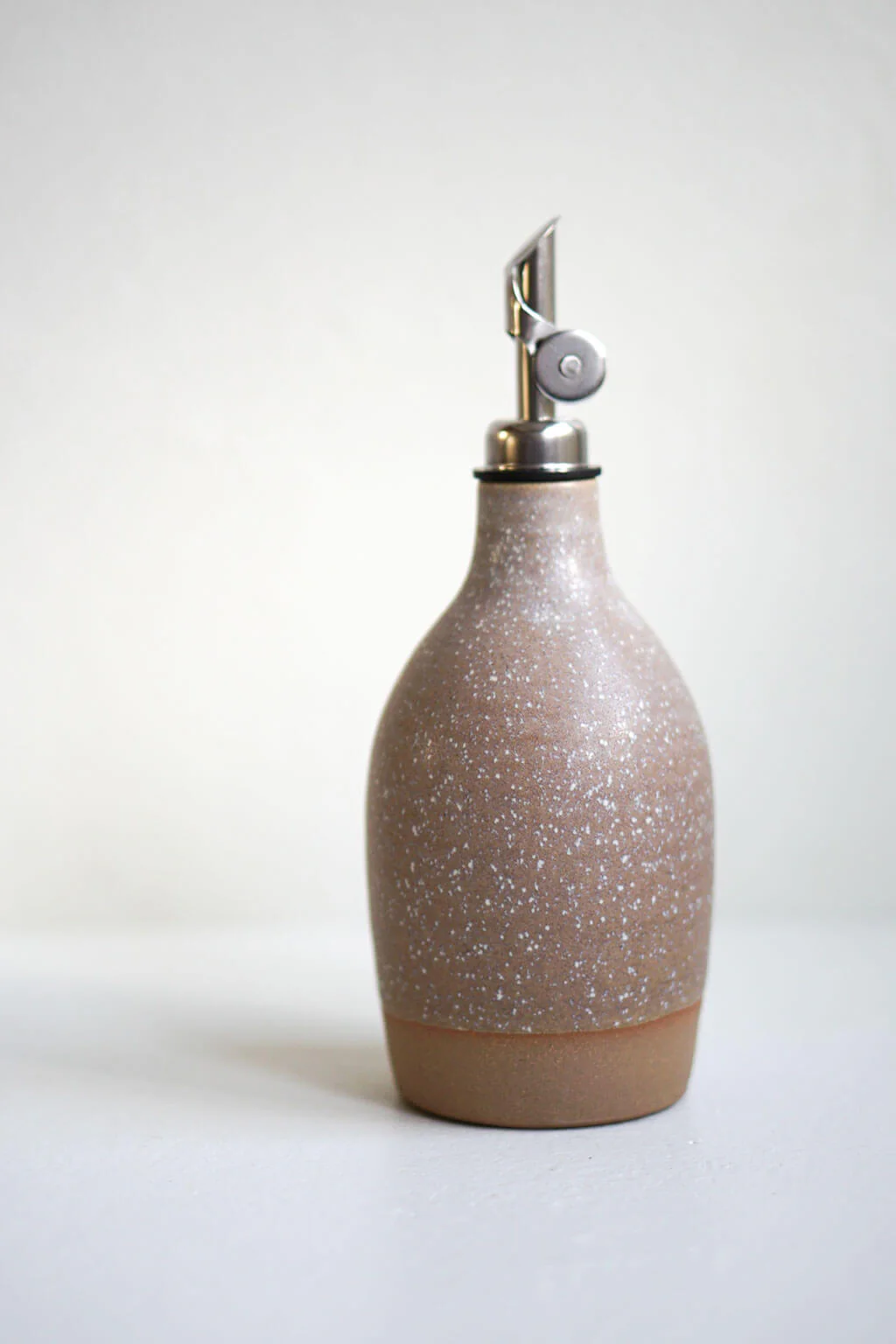 Handcrafted Ceramic Oil Bottle in a Brown Sandstone Finish. Rustic decanter for cooking oil.