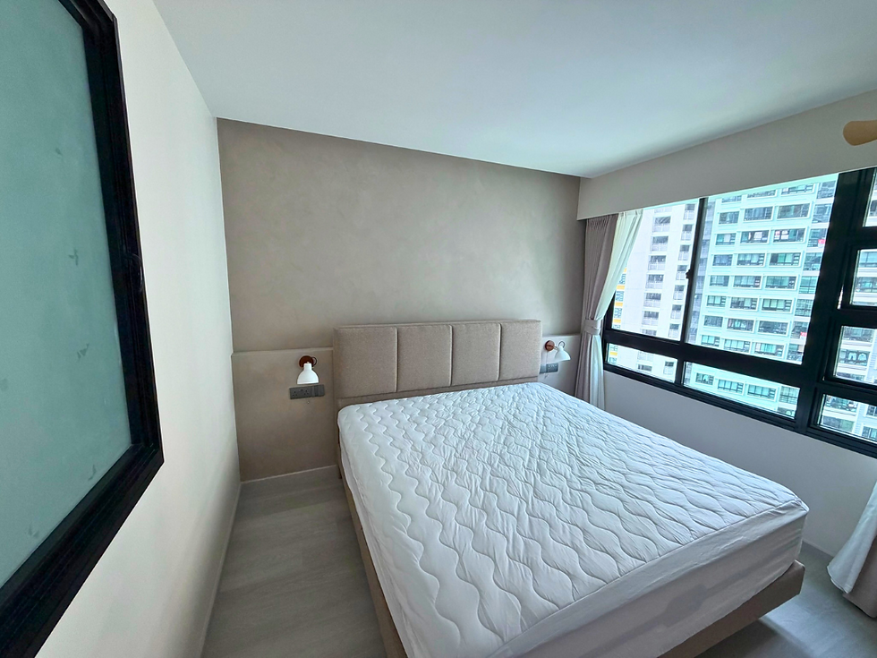 Minimal bedroom with a feature wall painted with limewash.