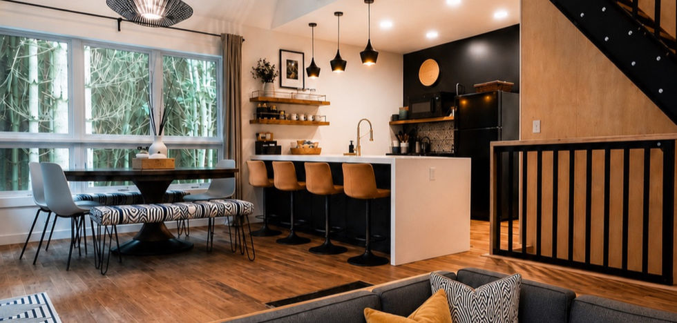 Conversation pit and dining area with steel staircase at the Carpenter's Cabin