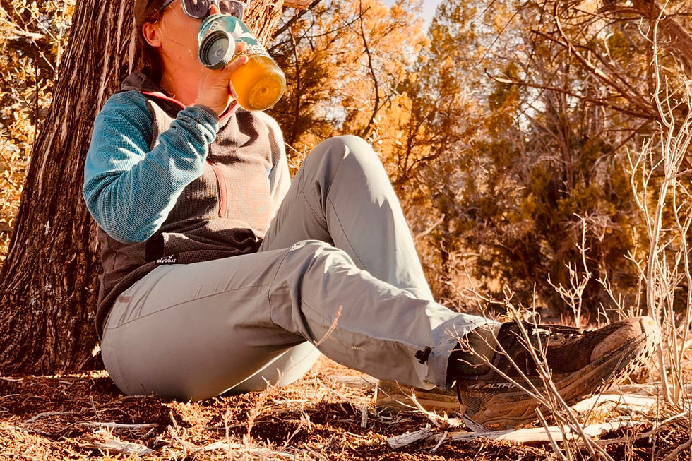 woman resting after a hike in the woods