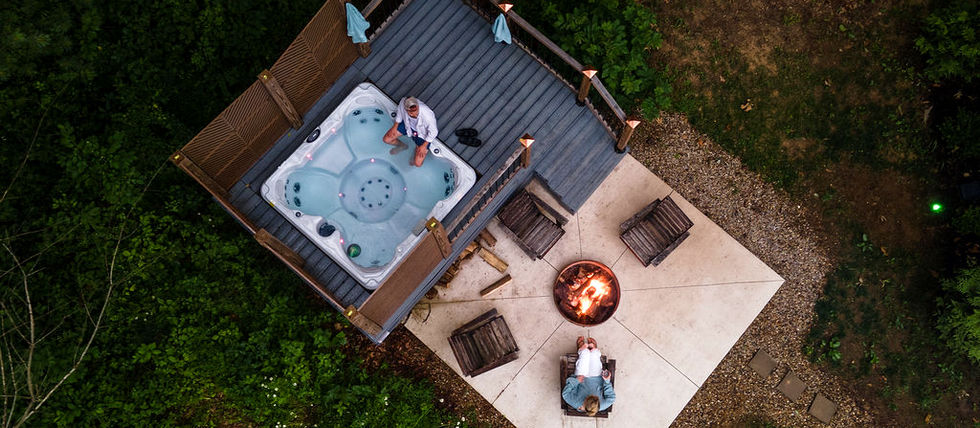 Aerial view of the hot tub deck and wood firepit patio at Twelve34 House