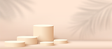 Various cylindrical podiums on a light peach background with leaf shadows.