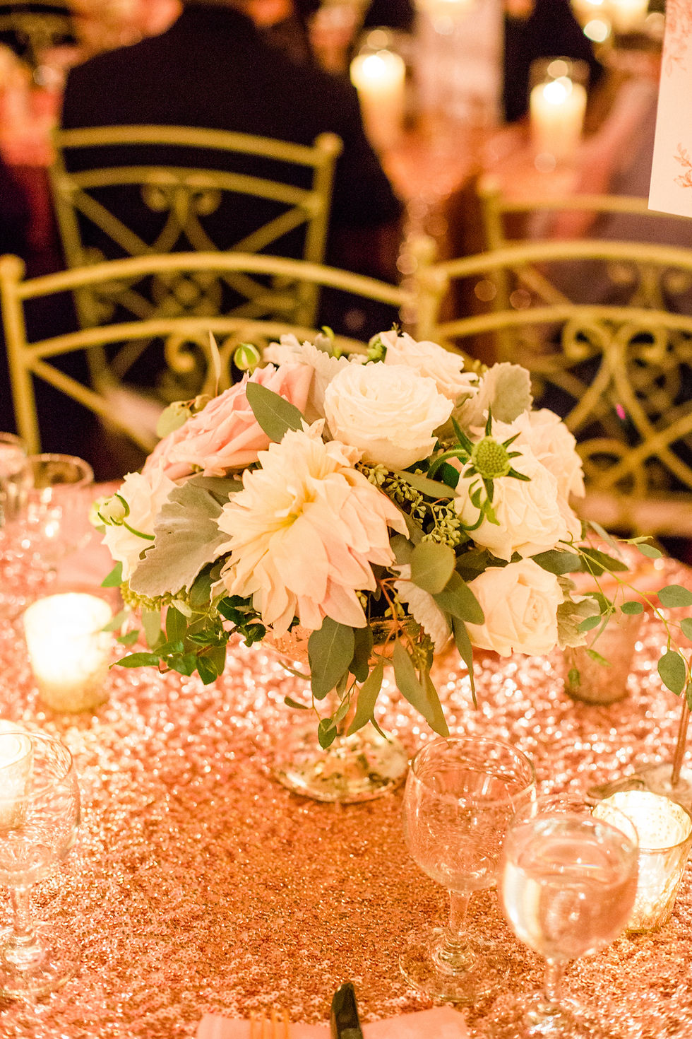 Blush pink and soft green centerpiece at reception