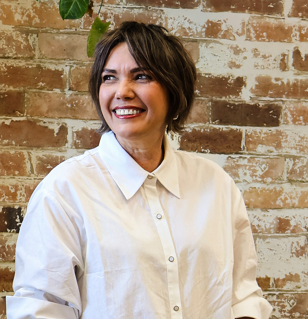 Smiling woman with short hair at Evernew Hair Studio