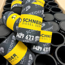 A box of branded stubby coolers.