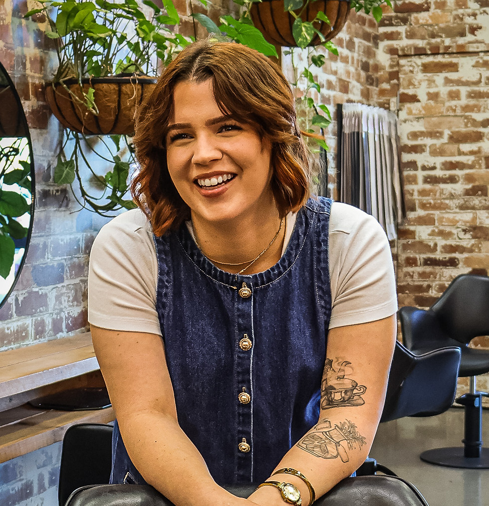Smiling woman at Evernew Hair Studio