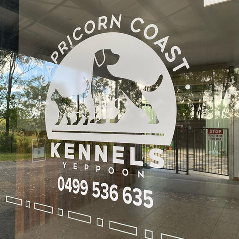 Capricorn Coast Kennels Yeppoon vinyl lettering on a  glass door.