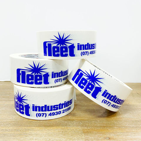 A stack of rolls of Fleet Industries stickers.