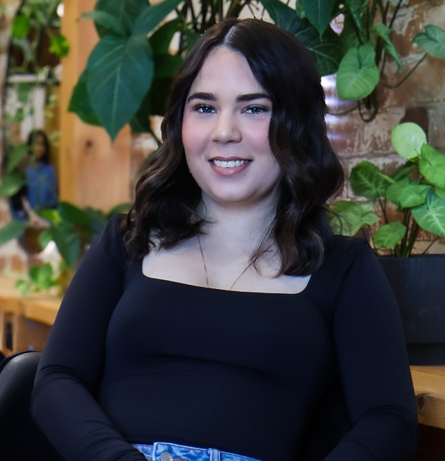 Woman with new hairstyle at Evernew Hair Studio.