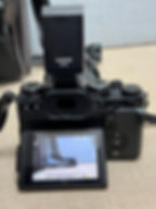 Thumbnail: Fujifilm X-T3 mirrorless camera with XF 18-135mm WR lens, external flash, two batteries, SD card, neck strap, and padded carr