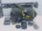 Nikon D5600 DSLR camera kit with two lenses, including the 18-55mm and 70-300mm, a camera bag, and a tripod.