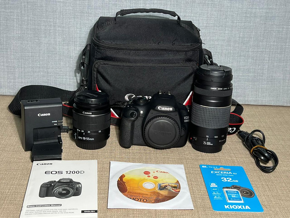 Canon EOS 1200D DSLR camera with EF-S 18-55mm and EF 75-300mm lenses, original battery, charger, 32GB SD card, neck strap, an