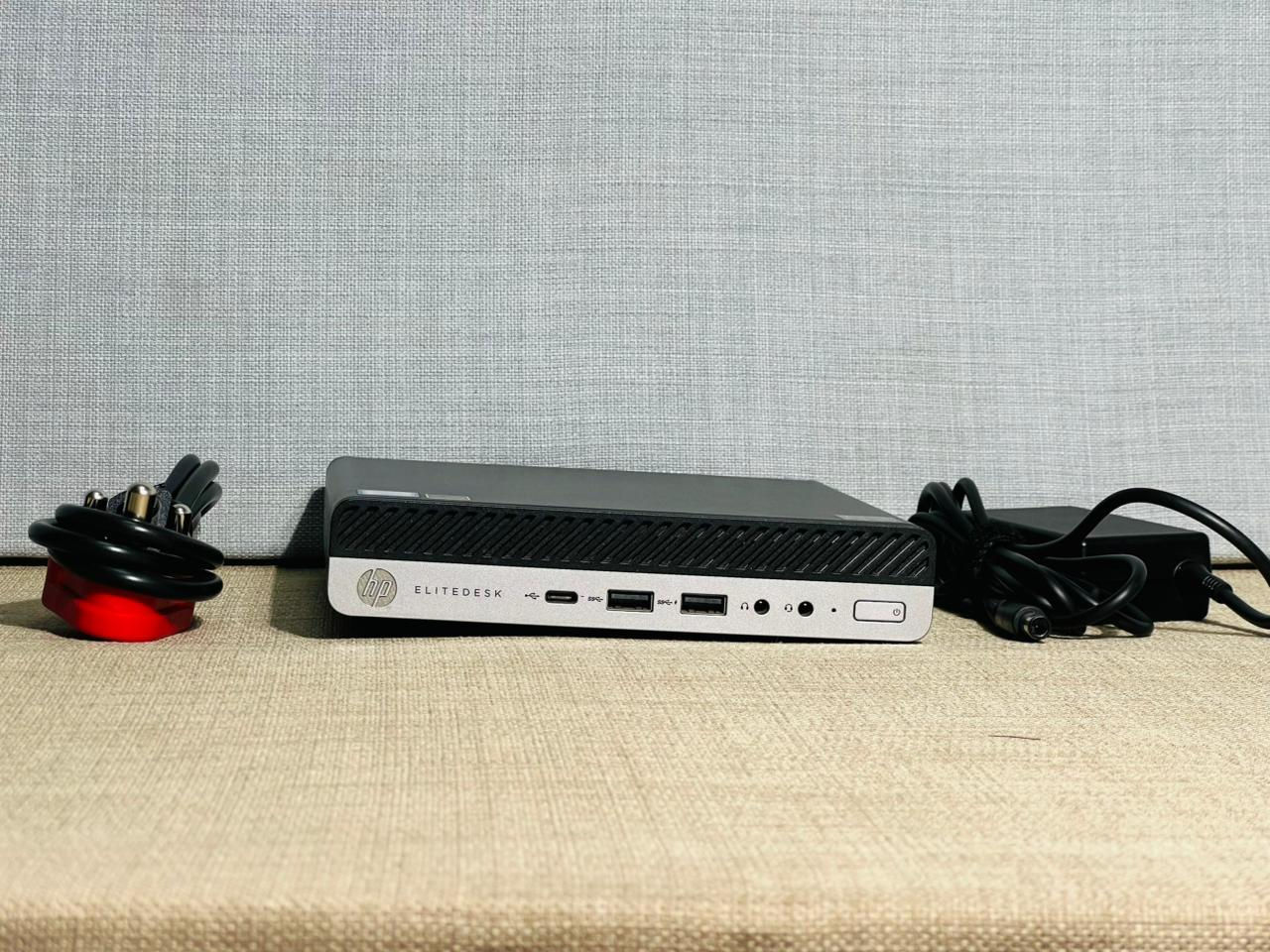 HP EliteDesk 800 G4 Desktop Mini ultra-compact business PC with power adapter and South African plug, shown in excellent pre-