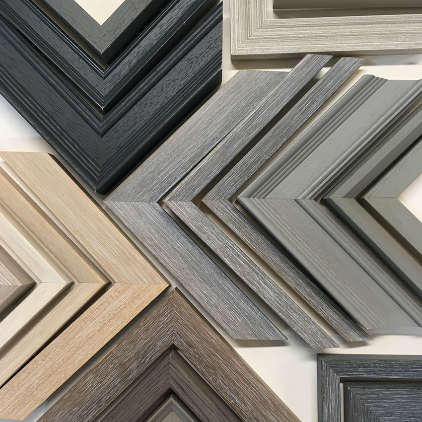 a variety of wooden frames are arranged in a diagonal pattern