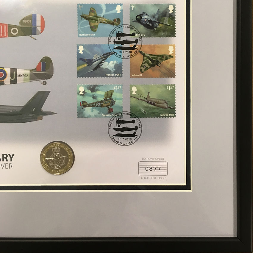 a framed picture of airplanes and postage stamps