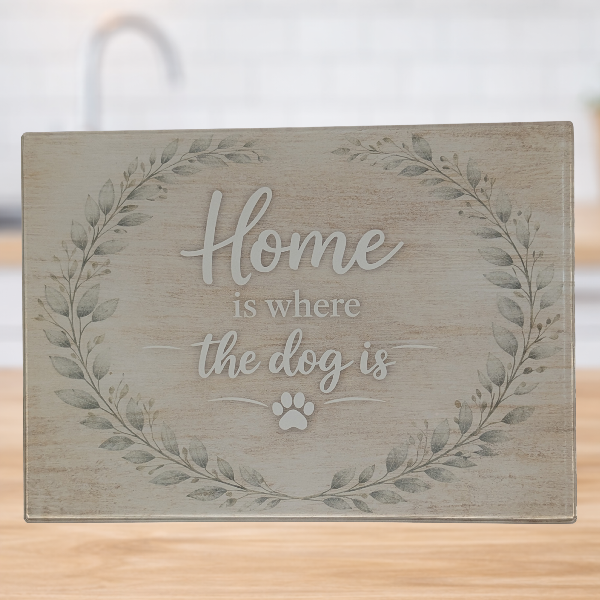 Home is where the dog is glass chopping board with rustic leaf wreath design in modern kitchen