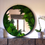 Thumbnail: Frontal view of round moss mirror above console table