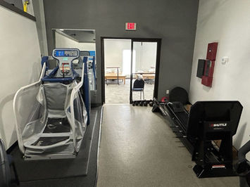 Fitness room with anti-gravity treadmill and gym equipment