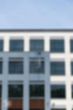 Drone spraying a modern building