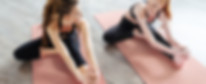 Women Stretching on Yoga Mat