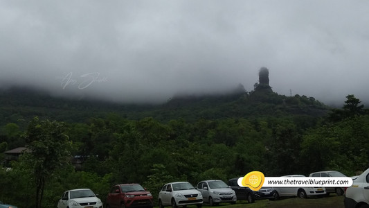 Devkund Waterfall parking lot with cars
