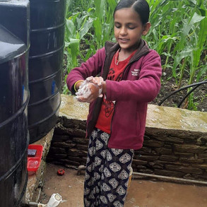 Student washing at Wagla School