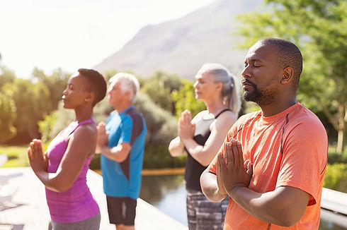 A group of people doing yoga