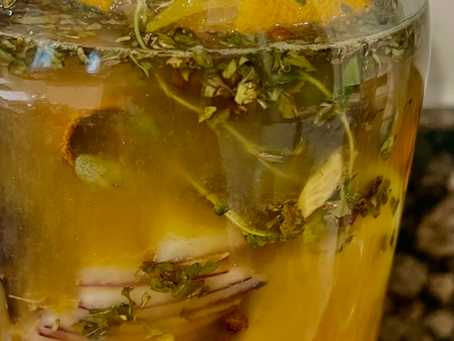 A photo of the glass jar of fire cider.