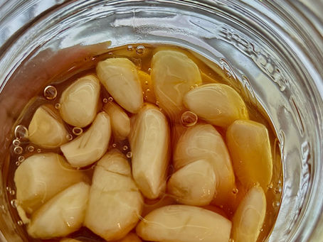 Whole garlic cloves in honey