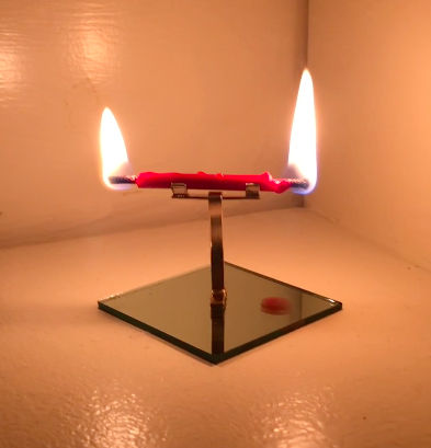 Mirrored Candle Burning at Both Ends, NFS