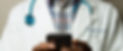 Doctor%20Holding%20Cell%20Phone_edited.j