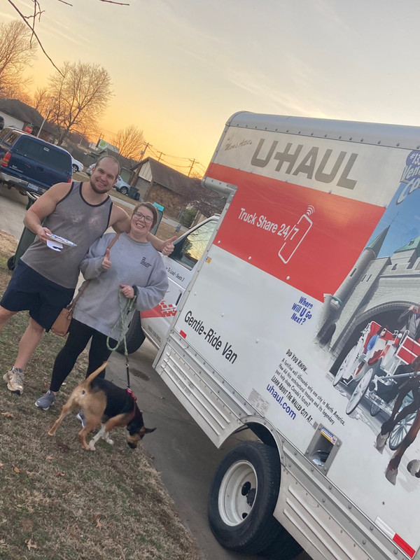 Happy family posing after move has been serviced