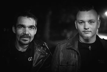 Gustav Müller and Christoph Rebhand looking into camera while standing next to each other