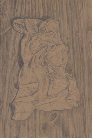 white undershirt on woodgrain surface