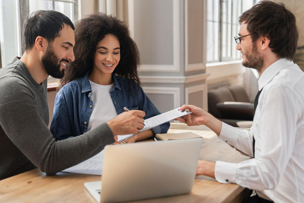 A couple amicably discusses the uncontested division of their house with a consultant, showcasing a positive and cooperative approach to their separation.