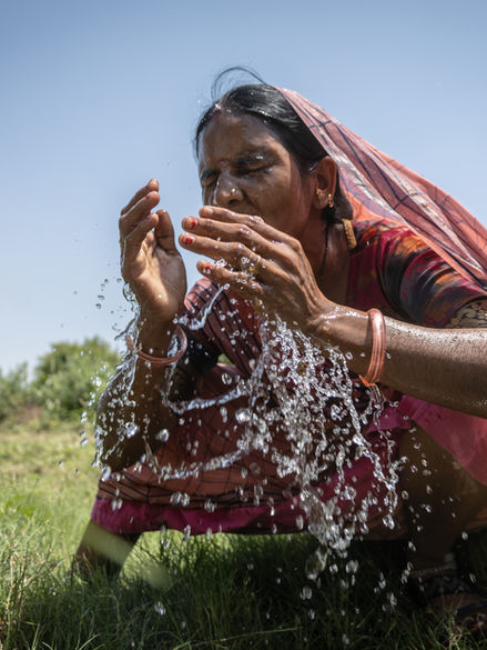Woman washing her face